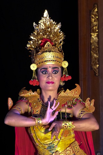 Balinese dancer with elaborate headdress at Ubud Palace in Bali