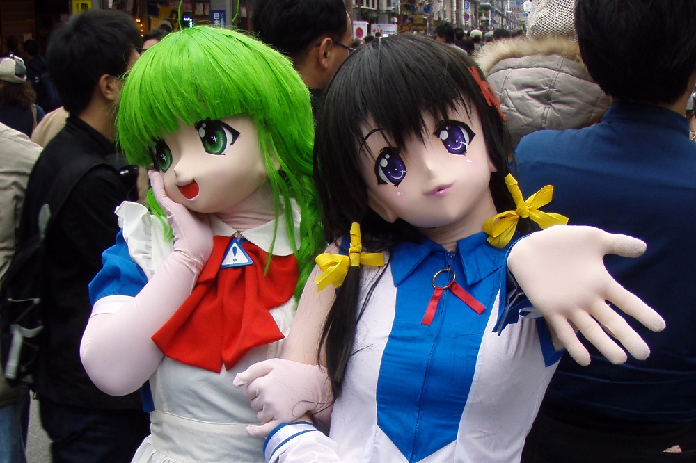Cosplayers dressed as manga schoolgirl characters at Nipponbashi Street Festa in Osaka, Japan