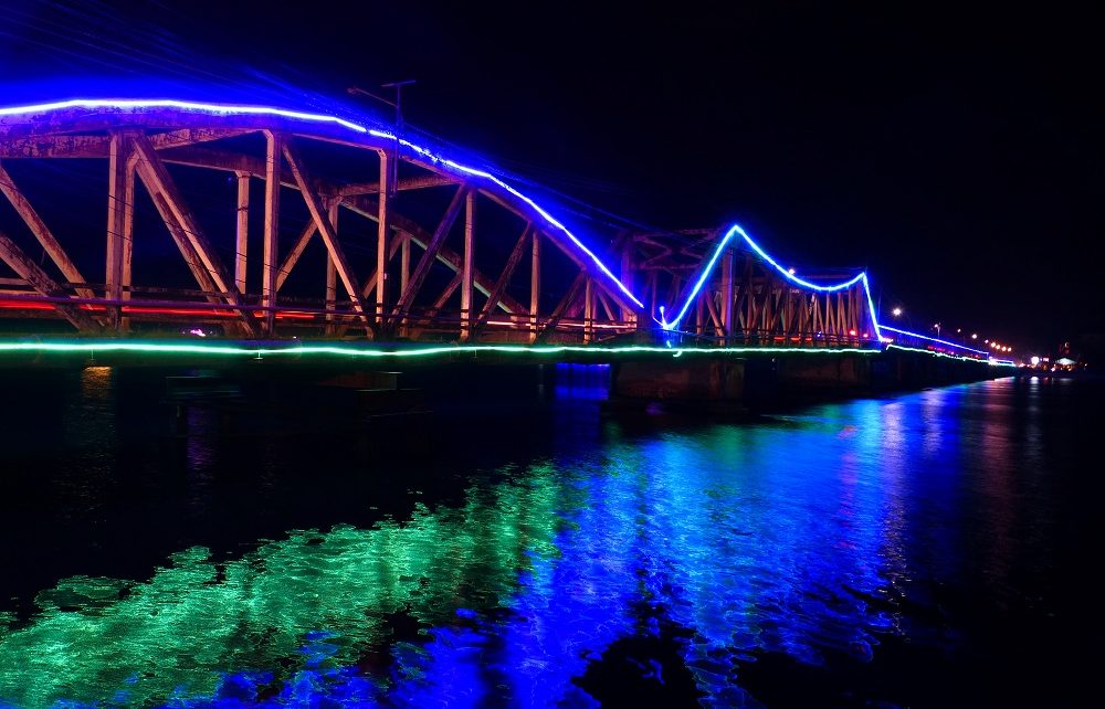 Entanou bridge lit up at night in Kampot, Cambodia