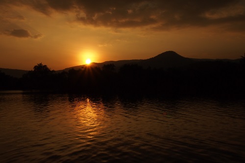 View of river and mountains at sunset in Kampot, Cambodia