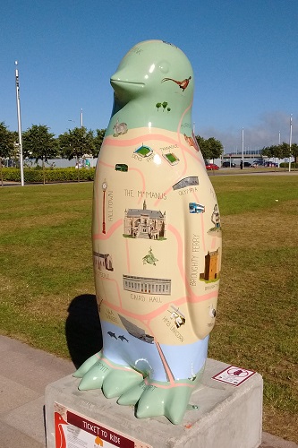 Dundee map themed penguin statue in park at Maggie's Penguin Parade, Scotland