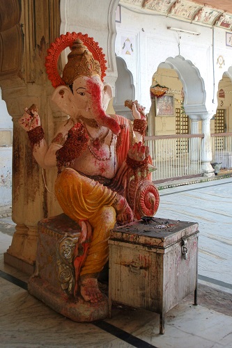 Statue of Ganesha smudged with red powder at Galtaji Monkey Temple, near Jaipur, India