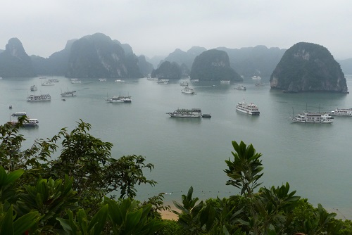 Ti Top Island and view of cruise boats on Halong Bay, Vietnam