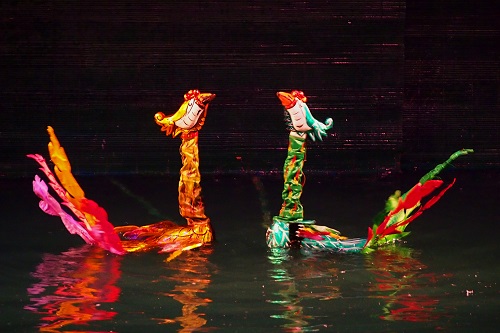 Two phoenixes on water at Thang Long Water Puppet Theatre in Hanoi, Vietnam