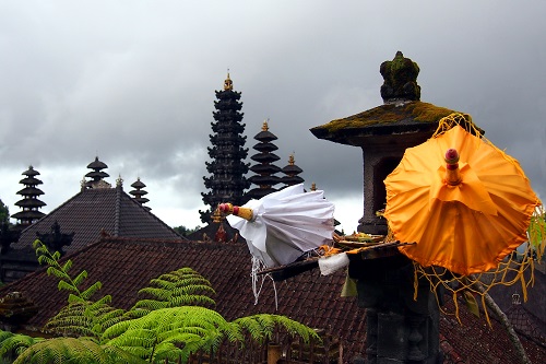 Closed umbrellas on a stone lantern at Pura Besakih temple in Bali, Indonesia