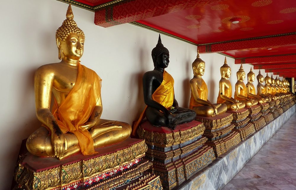 Row of Buddhas at Wat Pho temple in Bangkok, Thailand