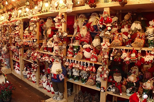 Shelves stacked with Santa figures at Manchester Christmas Market in England