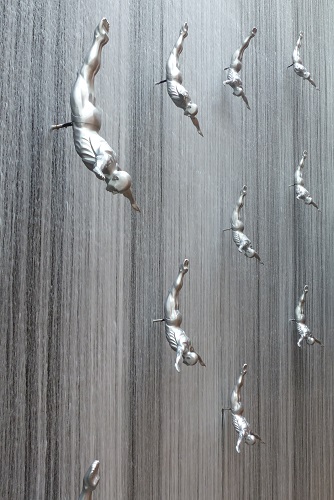 Diver sculptures on waterfall in Dubai Mall, UAE