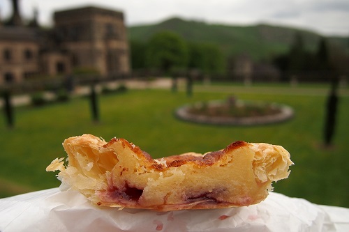 Bakewell pudding with house and garden behind in Peak District, England