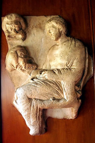 Carving of actor with masks at Lyme, Peak District