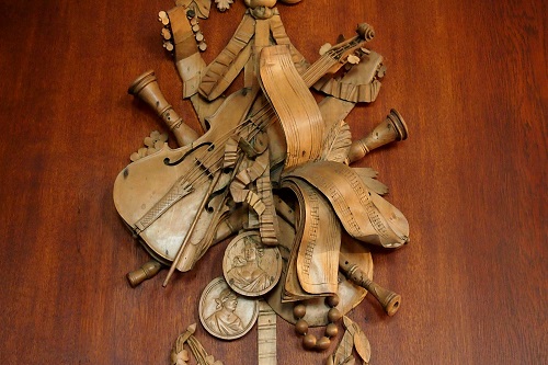 Carving of musical instruments at Lyme, Peak District