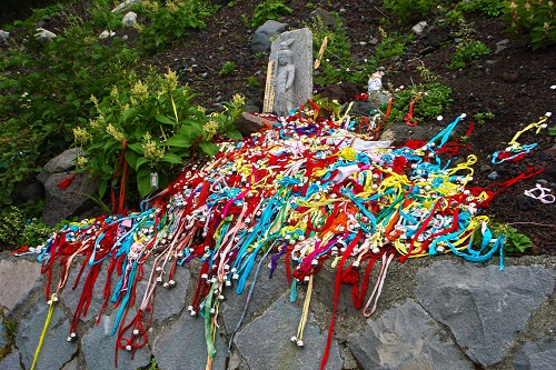 Piles of bells on the path up Mount Fuji, Japan