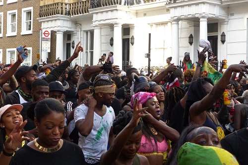 Street packed with revellers at Notting Hill Carnival in London, England