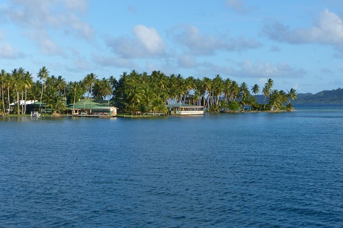 Low building and palm trees at Blue Lagoon Resort in Chuuk, Micronesia