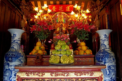 Fruit offerings inside the One Pillar Pagoda in Hanoi, Vietnam