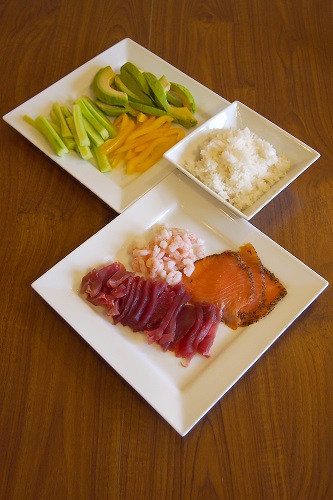 Temakizushi toppings: sashimi, sushi rice and vegetables