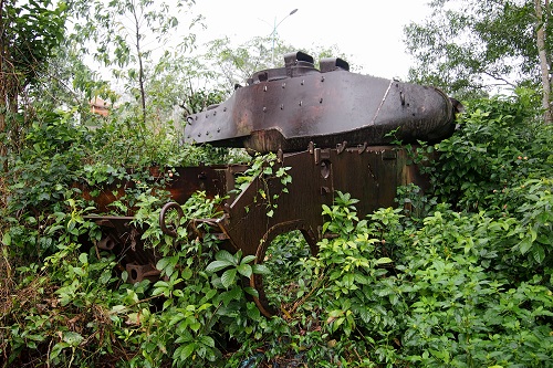 Tank lost in undergrowth at Doc Mieu Base in the DMZ, Vietnam