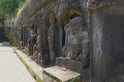 Long frieze of rock carvings at Yeh Pulu in Bali, Indonesia