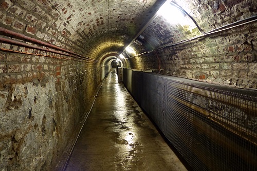 Looking down Victorian brick tunnel at Crumlin Road Gaol in Belfast, Northern Ireland