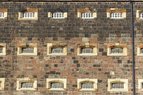 Barred windows of cells at Crumlin Road Gaol in Belfast, Northern Ireland